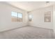 Bedroom showcasing bright windows and plush carpeting at 17225 W Calle Lejos --, Surprise, AZ 85387