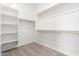Spacious walk-in closet with built-in shelving and hanging rods for optimal organization at 17225 W Calle Lejos --, Surprise, AZ 85387