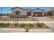 Charming single-story home featuring desert landscaping, a paved driveway, and a neutral color palette at 17225 W Calle Lejos --, Surprise, AZ 85387