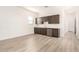 This kitchenette features sleek cabinetry and a stainless steel dishwasher at 17225 W Calle Lejos --, Surprise, AZ 85387