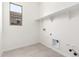 Laundry room features white walls and tile flooring at 17225 W Calle Lejos --, Surprise, AZ 85387