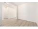 Well-lit living room with modern flooring and open doorway at 17225 W Calle Lejos --, Surprise, AZ 85387