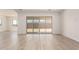 Spacious living room with sliding glass doors and modern flooring at 17225 W Calle Lejos --, Surprise, AZ 85387