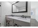 Double vanity bathroom with modern fixtures and large mirror at 8562 E Indian School Rd # E, Scottsdale, AZ 85251