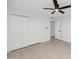 Bedroom with large closet and wood-look tile flooring at 8562 E Indian School Rd # E, Scottsdale, AZ 85251