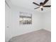 Bedroom with window and wood-look tile flooring at 8562 E Indian School Rd # E, Scottsdale, AZ 85251