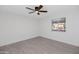 Well-lit bedroom with ceiling fan and wood-look tile floors at 8562 E Indian School Rd # E, Scottsdale, AZ 85251