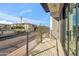 Private balcony overlooking a city street with modern metal railings at 1501 N Miller Rd # 1011, Scottsdale, AZ 85257