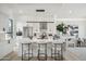 Modern kitchen with marble island, stainless steel appliances, and white cabinetry at 1501 N Miller Rd # 1011, Scottsdale, AZ 85257