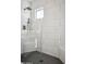 Large walk-in shower with a built-in seat and hexagonal tile at 1501 N Miller Rd # 1011, Scottsdale, AZ 85257