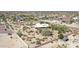 Aerial view showcasing the home's location on a spacious desert lot at 19927 W Meadowbrook Ave, Litchfield Park, AZ 85340