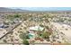 Aerial view of property highlighting the pool and surrounding desert landscape at 19927 W Meadowbrook Ave, Litchfield Park, AZ 85340