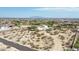 Aerial view showcasing a home's expansive lot and desert setting at 19927 W Meadowbrook Ave, Litchfield Park, AZ 85340