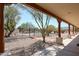 Covered patio area with a view of the pool and desert landscape at 19927 W Meadowbrook Ave, Litchfield Park, AZ 85340