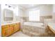 Bathroom boasts double sinks and a large soaking tub at 19927 W Meadowbrook Ave, Litchfield Park, AZ 85340