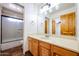 Bathroom with vanity, shower, and tile flooring at 19927 W Meadowbrook Ave, Litchfield Park, AZ 85340