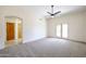 Bedroom with French doors and ceiling fan at 19927 W Meadowbrook Ave, Litchfield Park, AZ 85340