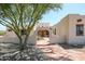 Home exterior with a stone path and arched entryway at 19927 W Meadowbrook Ave, Litchfield Park, AZ 85340