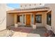 Beautiful entryway with wood door and stone pathway at 19927 W Meadowbrook Ave, Litchfield Park, AZ 85340