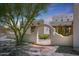 Stone path leads to arched entryway at 19927 W Meadowbrook Ave, Litchfield Park, AZ 85340