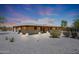 Stucco home with wood-beamed covered patio at 19927 W Meadowbrook Ave, Litchfield Park, AZ 85340