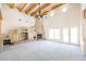 Large living room featuring a fireplace and wood beams at 19927 W Meadowbrook Ave, Litchfield Park, AZ 85340