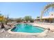 Sparkling pool with a rock waterfall, mountain backdrop at 19927 W Meadowbrook Ave, Litchfield Park, AZ 85340