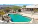 Inviting kidney-shaped pool with rock waterfall feature at 19927 W Meadowbrook Ave, Litchfield Park, AZ 85340