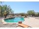 Relaxing kidney-shaped pool with a rock waterfall feature at 19927 W Meadowbrook Ave, Litchfield Park, AZ 85340