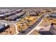 Aerial view of a new community featuring a neighborhood park and several houses at 12179 E Sereno Rd, Gold Canyon, AZ 85118