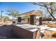 Community BBQ area with granite counter tops and picnic tables at 12179 E Sereno Rd, Gold Canyon, AZ 85118