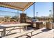 Community BBQ area with picnic tables and grills at 12179 E Sereno Rd, Gold Canyon, AZ 85118