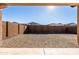 Sunlit gravel backyard viewed from covered patio at 12179 E Sereno Rd, Gold Canyon, AZ 85118