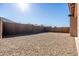 Gravel backyard with house and block wall at 12179 E Sereno Rd, Gold Canyon, AZ 85118