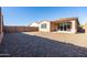 Backyard view of house with sliding doors at 12179 E Sereno Rd, Gold Canyon, AZ 85118