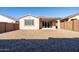 Backyard view of house with sliding doors at 12179 E Sereno Rd, Gold Canyon, AZ 85118