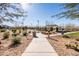 Pathway through community park with benches and trees at 12179 E Sereno Rd, Gold Canyon, AZ 85118