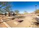 Community cornhole area with multiple boards and a covered picnic area at 12179 E Sereno Rd, Gold Canyon, AZ 85118