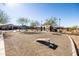 Community cornhole area with multiple boards and a covered picnic area at 12179 E Sereno Rd, Gold Canyon, AZ 85118