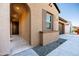 Front entry with arched doorway, neutral color palette, and tile flooring at 12179 E Sereno Rd, Gold Canyon, AZ 85118