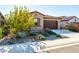 Front view of a one-story house with mature trees and gravel landscaping at 12179 E Sereno Rd, Gold Canyon, AZ 85118