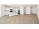 Modern white kitchen with stainless steel appliances and island at 12179 E Sereno Rd, Gold Canyon, AZ 85118