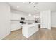 Modern kitchen with white cabinets, quartz countertops, and island at 12179 E Sereno Rd, Gold Canyon, AZ 85118