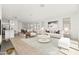 Open concept living room with neutral decor and view to kitchen and dining area at 12179 E Sereno Rd, Gold Canyon, AZ 85118