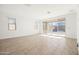 Bright and airy living room with sliding glass doors leading to backyard at 12179 E Sereno Rd, Gold Canyon, AZ 85118