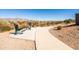 Outdoor fitness area with exercise equipment and a paved pathway at 12179 E Sereno Rd, Gold Canyon, AZ 85118