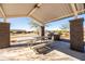 Covered picnic area with large table and built-in BBQ at 12179 E Sereno Rd, Gold Canyon, AZ 85118