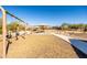 Community playground with swings and shaded area at 12179 E Sereno Rd, Gold Canyon, AZ 85118