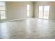 Spacious living room with tile floor and sliding glass doors at 15820 S Animas Rd, Arizona City, AZ 85123