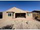 Spacious backyard with covered patio, perfect for outdoor entertaining and relaxation at 16205 W Berkeley Rd, Goodyear, AZ 85395